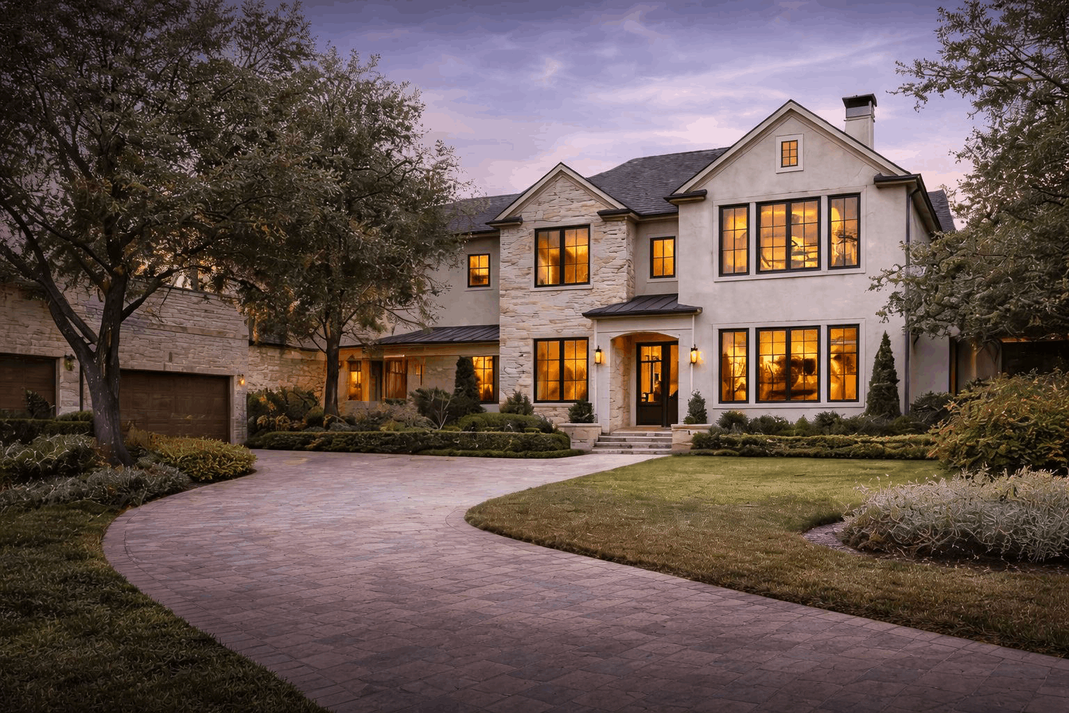 Houston home with a landscaped front yard at dusk